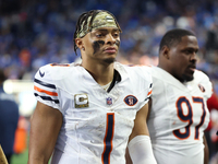 Chicago Bears quarterback Justin Fields (1) walks off the field after the conclusion of an NFL football game between the Chicago Bears and t...