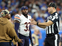 Chicago Bears cornerback Jaylon Johnson (33) discusses a call with down judge Brian Sakowski (112) during  an NFL  football game between the...