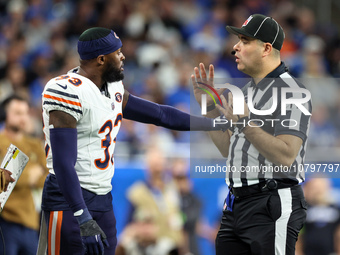 Chicago Bears cornerback Jaylon Johnson (33) discusses a call with down judge Brian Sakowski (112) during  an NFL  football game between the...