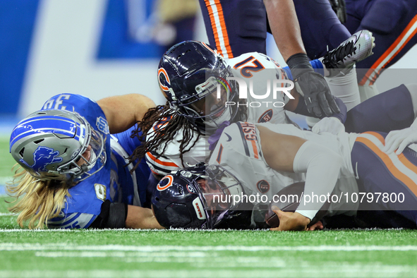 Chicago Bears quarterback Justin Fields (1) is sacked by Detroit Lions linebacker Alex Anzalone (34) during  an NFL  football game between t...