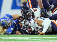 Chicago Bears quarterback Justin Fields (1) is sacked by Detroit Lions linebacker Alex Anzalone (34) during  an NFL  football game between t...