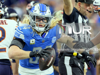 Detroit Lions linebacker Alex Anzalone (34) runs with the ball during  an NFL  football game between the Detroit Lions and the Chicago Bears...