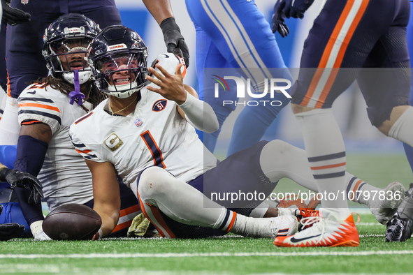 Chicago Bears quarterback Justin Fields (1) reacts after being sacked by Detroit Lions linebacker Alex Anzalone (34) during  an NFL  footbal...