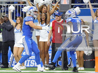 Detroit Lions tight end Sam LaPorta (87) celebrates his 2-point conversion with wide receiver Josh Reynolds (8) during the second half of an...