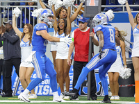 Detroit Lions tight end Sam LaPorta (87) celebrates his 2-point conversion with wide receiver Josh Reynolds (8) during the second half of an...