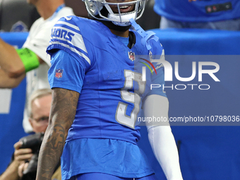 Detroit Lions wide receiver Jameson Williams (9) celebrates his touchdown during the second half of an NFL football game between the Chicago...