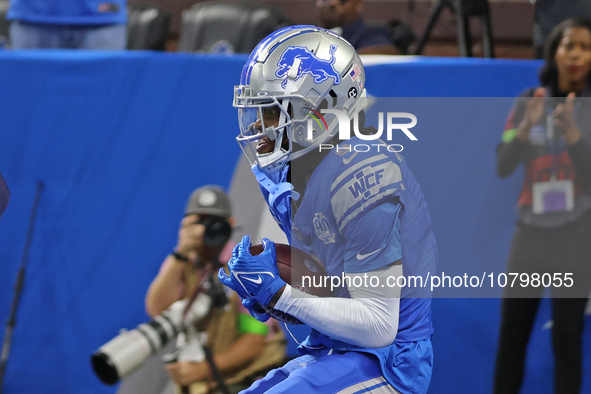 Detroit Lions wide receiver Jameson Williams (9) catches a pass for a touchdown during the second half of an NFL football game between the C...