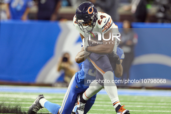 Chicago Bears running back Khalil Herbert (24) is stopped by Detroit Lions safety Brian Branch (32) during  an NFL  football game between th...