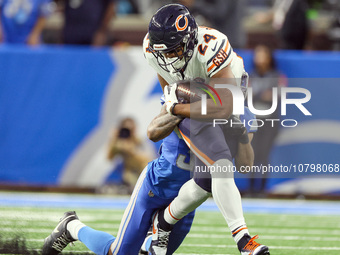 Chicago Bears running back Khalil Herbert (24) is stopped by Detroit Lions safety Brian Branch (32) during  an NFL  football game between th...