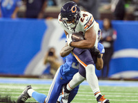 Chicago Bears running back Khalil Herbert (24) is stopped by Detroit Lions safety Brian Branch (32) during  an NFL  football game between th...