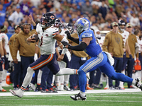 Chicago Bears quarterback Justin Fields (1) runs the ball against Detroit Lions linebacker Derrick Barnes (55) during the second half of an...