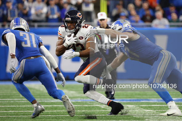 Chicago Bears running back Roschon Johnson (23) runs the ball during the second half of an NFL football game between the Chicago Bears and t...