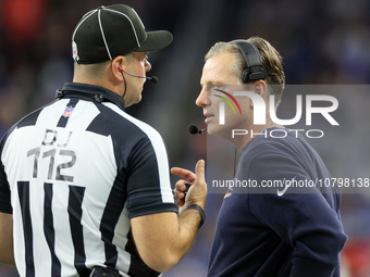 Chicago Bears head coach Matt Eberflus talks with down judge Brian Sakowski during  an NFL  football game between the Detroit Lions and the...