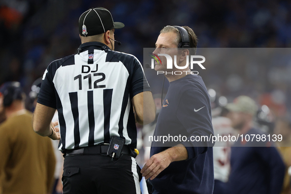 Chicago Bears head coach Matt Eberflus talks to down judge Brian Sakowski during the first half of an NFL football game between the Chicago...