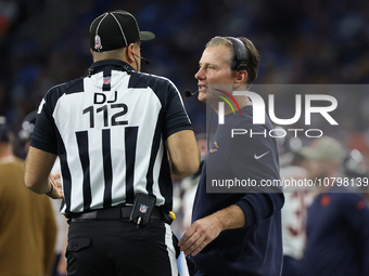 Chicago Bears head coach Matt Eberflus talks to down judge Brian Sakowski during the first half of an NFL football game between the Chicago...