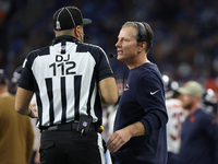 Chicago Bears head coach Matt Eberflus talks to down judge Brian Sakowski during the first half of an NFL football game between the Chicago...