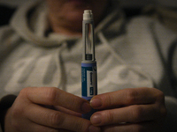 A woman holds an Ozempic needle shot pen in this photograph taken in Warsaw, Poland on 19 November, 2023. German regulator BfArM is consider...