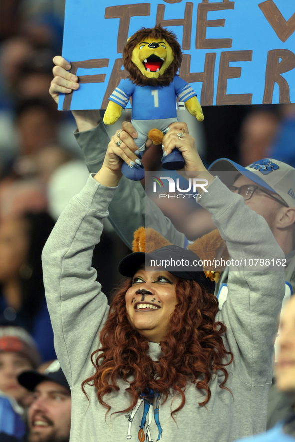 A fan holds up a stuffed lion during the Cub Cam during  an NFL  football game between the Detroit Lions and the Chicago Bears in Detroit, M...