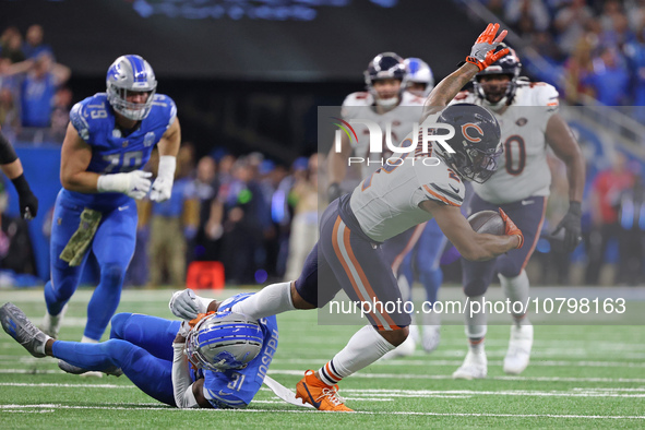 Chicago Bears wide receiver DJ Moore (2) runs the ball against Detroit Lions safety Kerby Joseph (31) during the first half of an NFL footba...