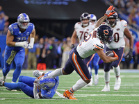 Chicago Bears wide receiver DJ Moore (2) runs the ball against Detroit Lions safety Kerby Joseph (31) during the first half of an NFL footba...