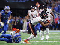 Chicago Bears wide receiver DJ Moore (2) runs the ball against Detroit Lions safety Kerby Joseph (31) during the first half of an NFL footba...