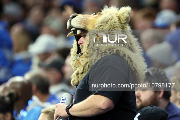 A fan wearing a Lion head watches the game during  an NFL  football game between the Detroit Lions and the Chicago Bears in Detroit, Michiga...