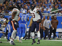 Chicago Bears linebacker T.J. Edwards (53) celebrates with linebacker Tremaine Edmunds (49) after an interception during the first half of a...