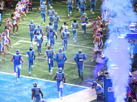 Detroit Lions players head to the field from the tunnel during an NFL football game between the Chicago Bears and the Detroit Lions in Detro...