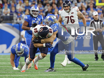 Chicago Bears tight end Cole Kmet (85) ia tackled by Detroit Lions linebacker Alex Anzalone (34) during the first half of an NFL football ga...