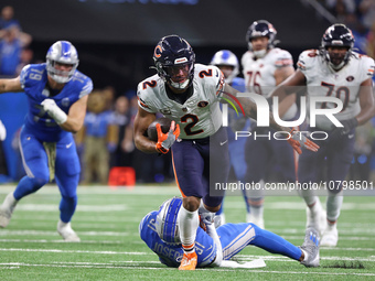 Chicago Bears wide receiver DJ Moore (2) runs the ball against Detroit Lions safety Kerby Joseph (31) during the first half of an NFL footba...