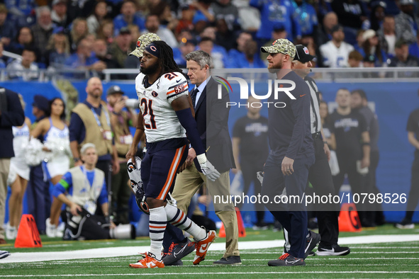 Chicago Bears running back D'Onta Foreman (21) is taken off the field after an ankle injury during the second half of an NFL football game b...