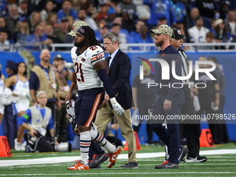 Chicago Bears running back D'Onta Foreman (21) is taken off the field after an ankle injury during the second half of an NFL football game b...