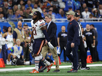 Chicago Bears running back D'Onta Foreman (21) is taken off the field after an ankle injury during the second half of an NFL football game b...