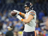 Chicago Bears tight end Robert Tonyan (18) looks to throw the ball down the field ahead of an NFL  football game between the Detroit Lions a...