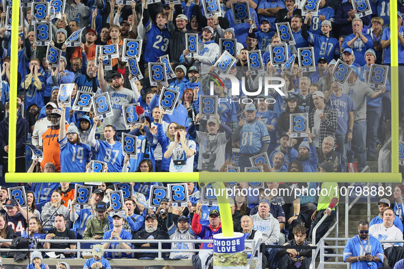 Fans behind the goal post in the end zone hold up signs for a third down during  an NFL  football game between the Detroit Lions and the Chi...