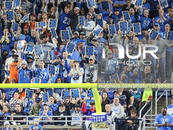 Fans behind the goal post in the end zone hold up signs for a third down during  an NFL  football game between the Detroit Lions and the Chi...