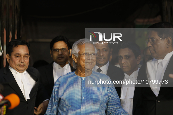 Nobel Peace Prize laureate and Grameen Telecom chairman Professor Muhammad Yunus with his lawyers seen seen in front of a labor court in Dha...