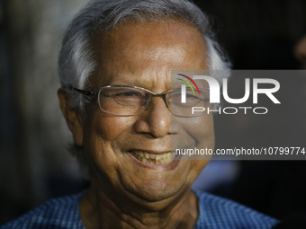 Nobel Peace Prize laureate and Grameen Telecom chairman Professor Muhammad Yunus speaks to journalists in front of a labor court in Dhaka, B...
