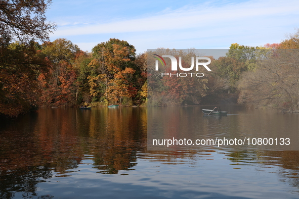 People enjoy a boat ride on The Lake in Central Park while enjoying the fall weather in New York City, New York , Wednesday, Nov. 8, 2023.  