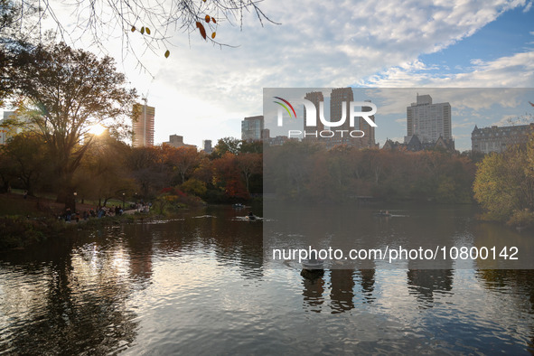 People enjoy a boat ride on The Lake in Central Park while enjoying the fall weather in New York City, New York , Monday, Nov. 6, 2023.  