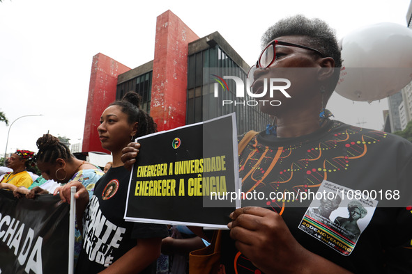 Protesters participate in a march to mark the celebrations for the 20th anniversary of the establishment of Black Consciousness Day, on Aven...