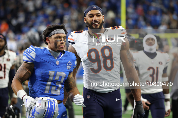 Detroit Lions running back Craig Reynolds (13) and Chicago Bears defensive end Montez Sweat (98) walk off the field after the conclusion of...