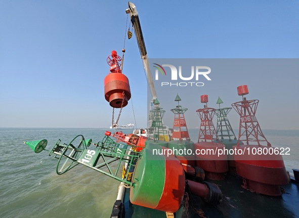 YANTAI, CHINA - NOVEMBER 21, 2023 - The ''Haixun 153'' navigation vessel releases a new beacon into the sea at the main channel of Longkou P...