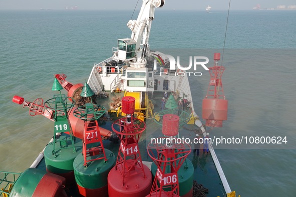 YANTAI, CHINA - NOVEMBER 21, 2023 - The ''Haixun 153'' navigation vessel releases a new beacon into the sea at the main channel of Longkou P...