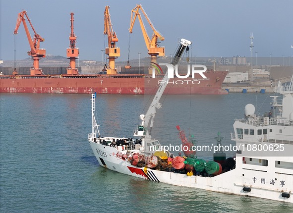 YANTAI, CHINA - NOVEMBER 21, 2023 - The ''Haixun 153'' navigation vessel releases a new beacon into the sea at the main channel of Longkou P...