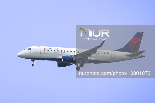 Delta Connection Embraer ERJ-175 passenger airplane operated by Republic Airlines spotted flying over Washington DC before landing at Ronald...