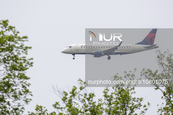 Delta Connection Embraer ERJ-175 passenger airplane operated by Republic Airlines spotted flying over Washington DC before landing at Ronald...