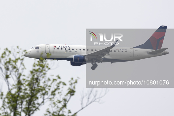 Delta Connection Embraer ERJ-175 passenger airplane operated by Republic Airlines spotted flying over Washington DC before landing at Ronald...