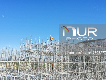 Workers are working at the construction site of the Xuancheng-Hangzhou Railway interchange in Huzhou, China, on November 22, 2023. (