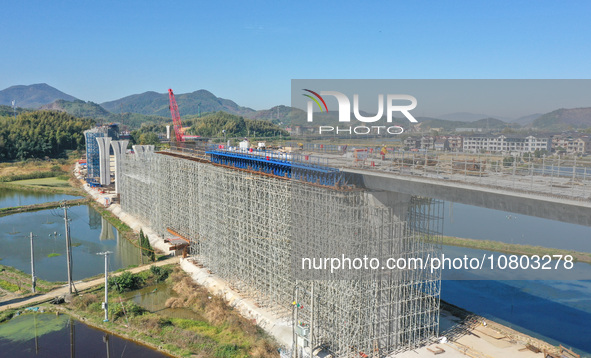 Workers are working at the construction site of the Xuancheng-Hangzhou Railway interchange in Huzhou, China, on November 22, 2023. 